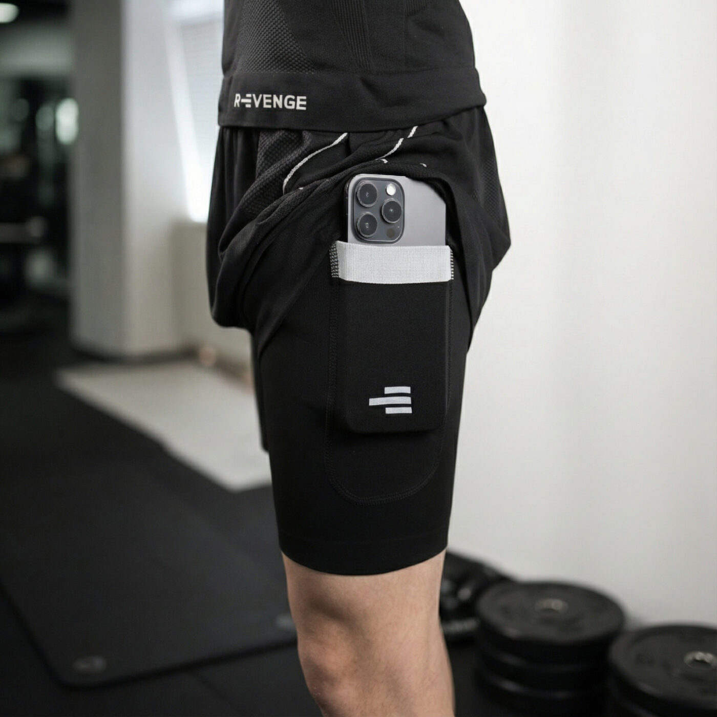Detail of the phone pocket on R-Evenge men’s technical shorts being worn